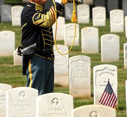 Retired Col. Sam Young plays Taps at Leavenworth Cemetery for Fort Larned soldiers who died 1859-1878