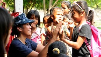 U.S. Navy electrician's mate teaches Indonesian girls a clapping game, 2012