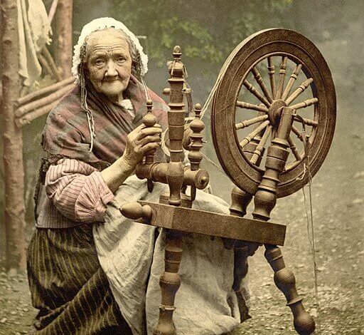 Elderly Irish woman at spinning wheel, 1890